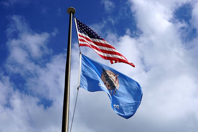 Oklahoma Day – Where the Wind Comes Sweeping Down the Plain (and Your Pup Leads the Way) - OK state flag